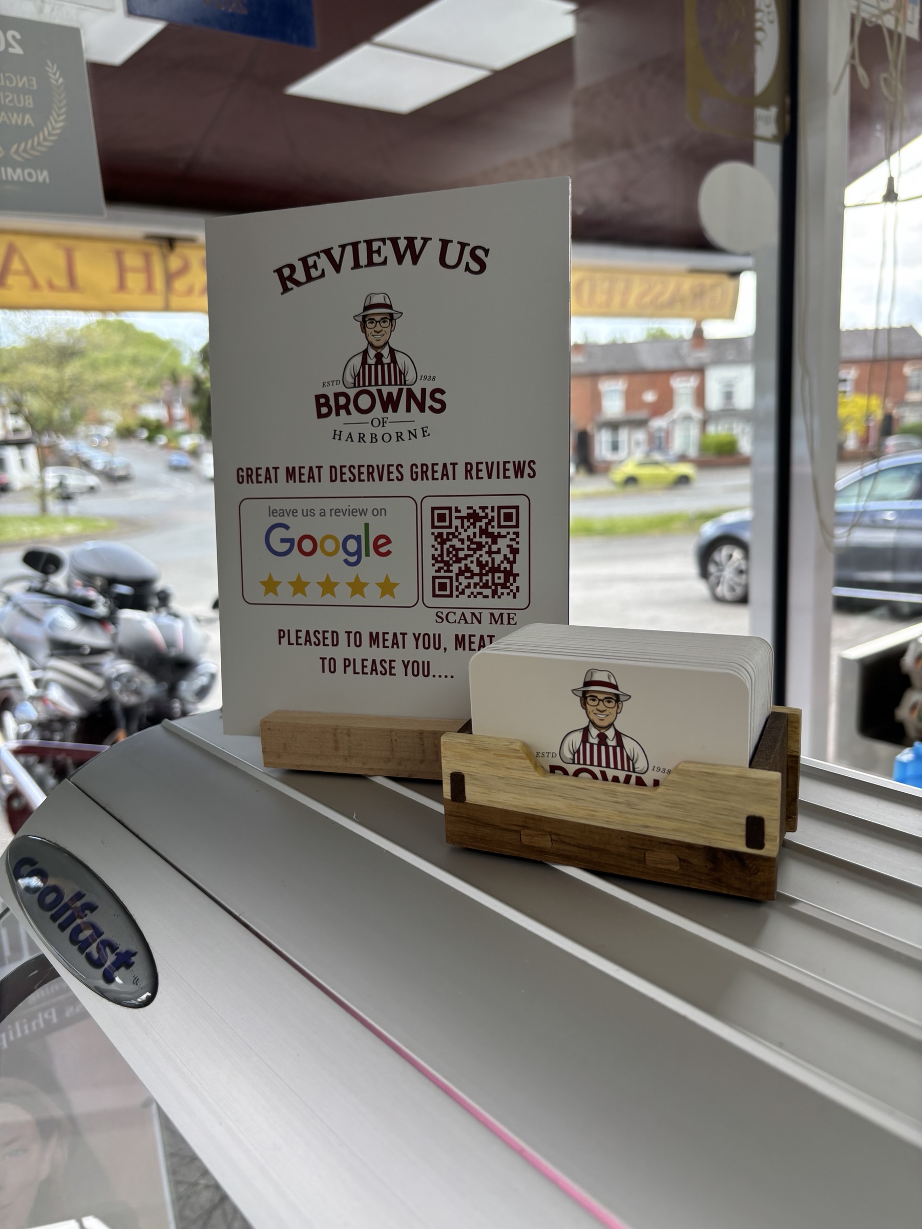 Browns of Harborne customer review sign and branded cards displayed at the counter